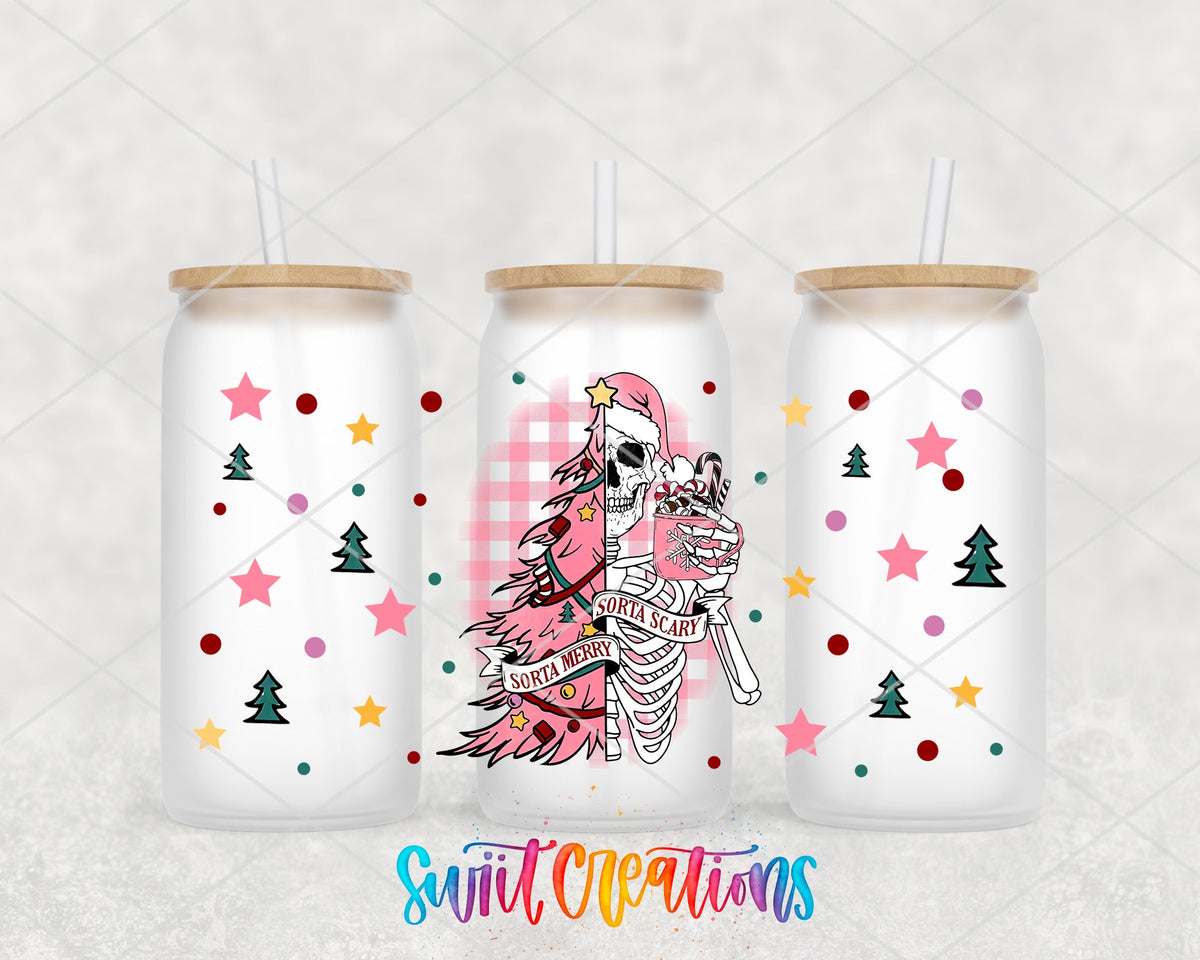 Sorta Merry Sorta Scary pink tree skeleton UV DTF wrap on three frosted glass cans