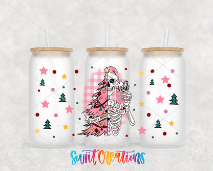 Sorta Merry Sorta Scary pink tree skeleton UV DTF wrap on three frosted glass cans