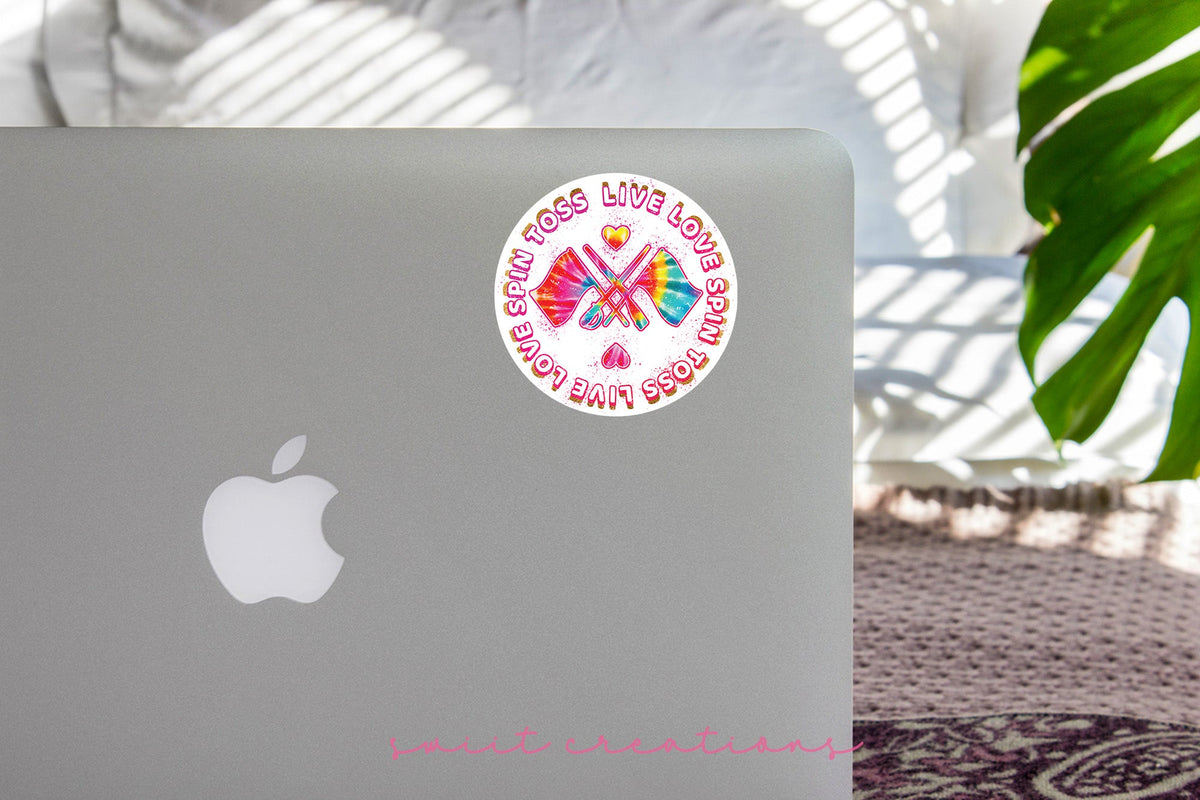 Spin Toss Live Love sticker on the lid of a silver laptop
