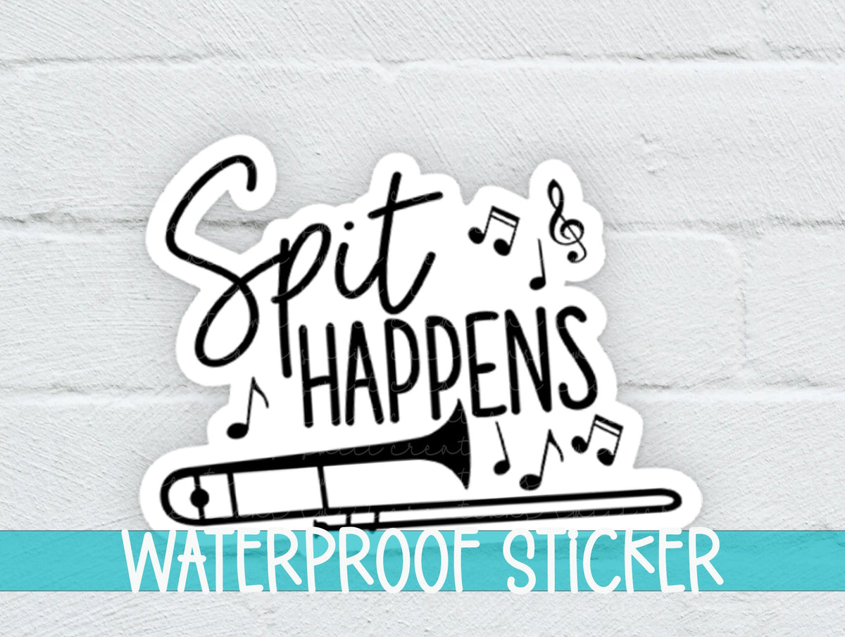 Spit Happens sticker on a white brick background with a waterproof sticker banner