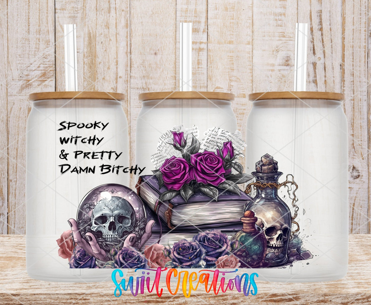 Spooky Witchy and Pretty Damn B*tchy UV DTF wrap on three clear glass cans with bamboo lids