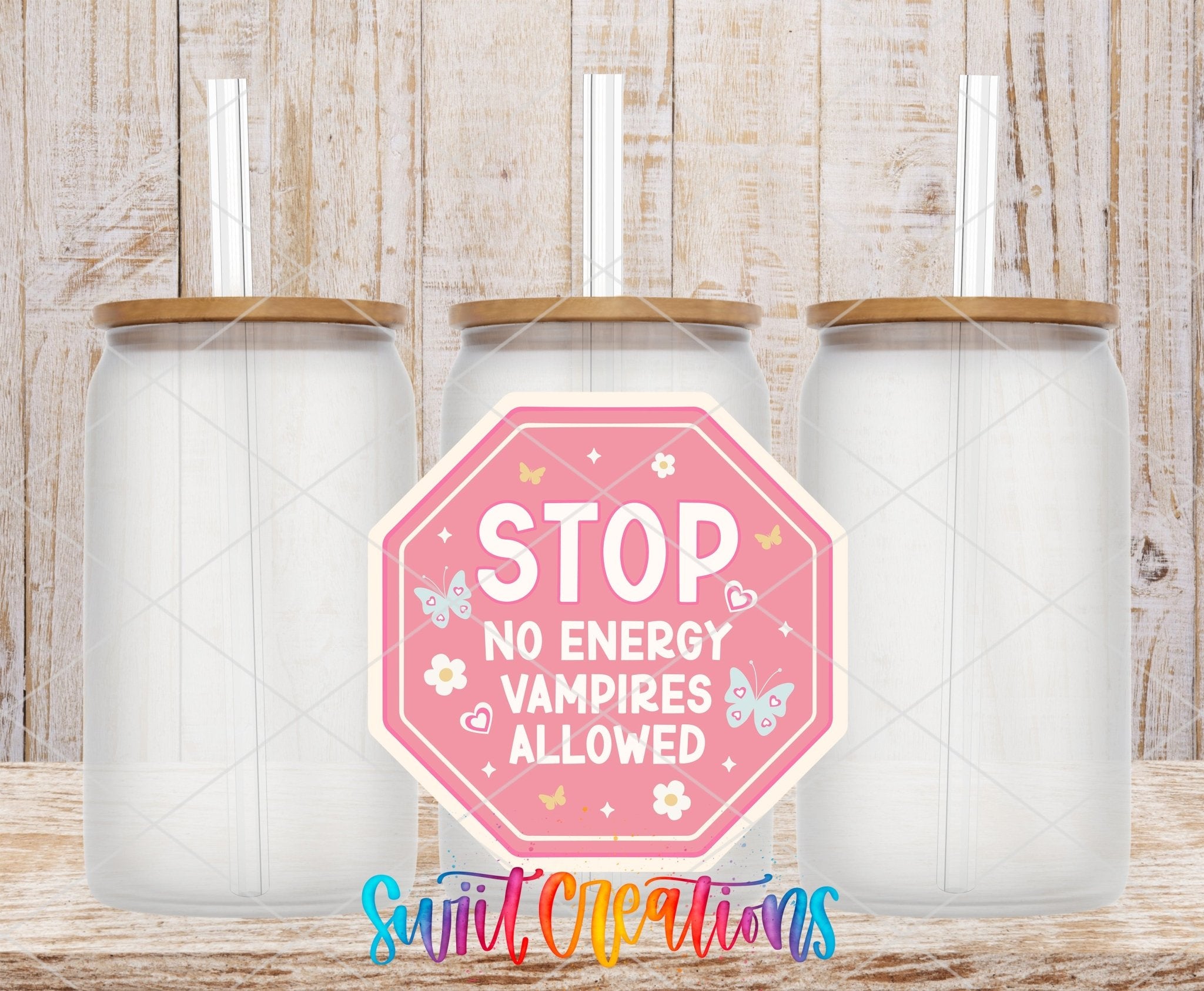 Stop No Energy Vampires UV DTF transfer applied to a clear glass can set from Swiit Creations