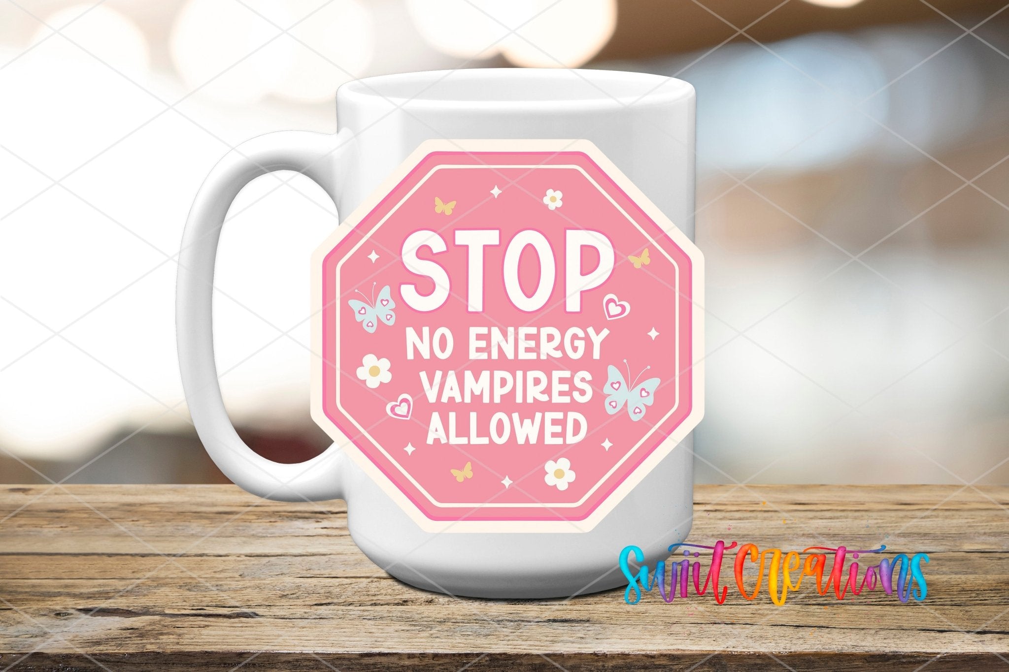 Stop No Energy Vampires UV DTF transfer displayed on a white ceramic mug from Swiit Creations