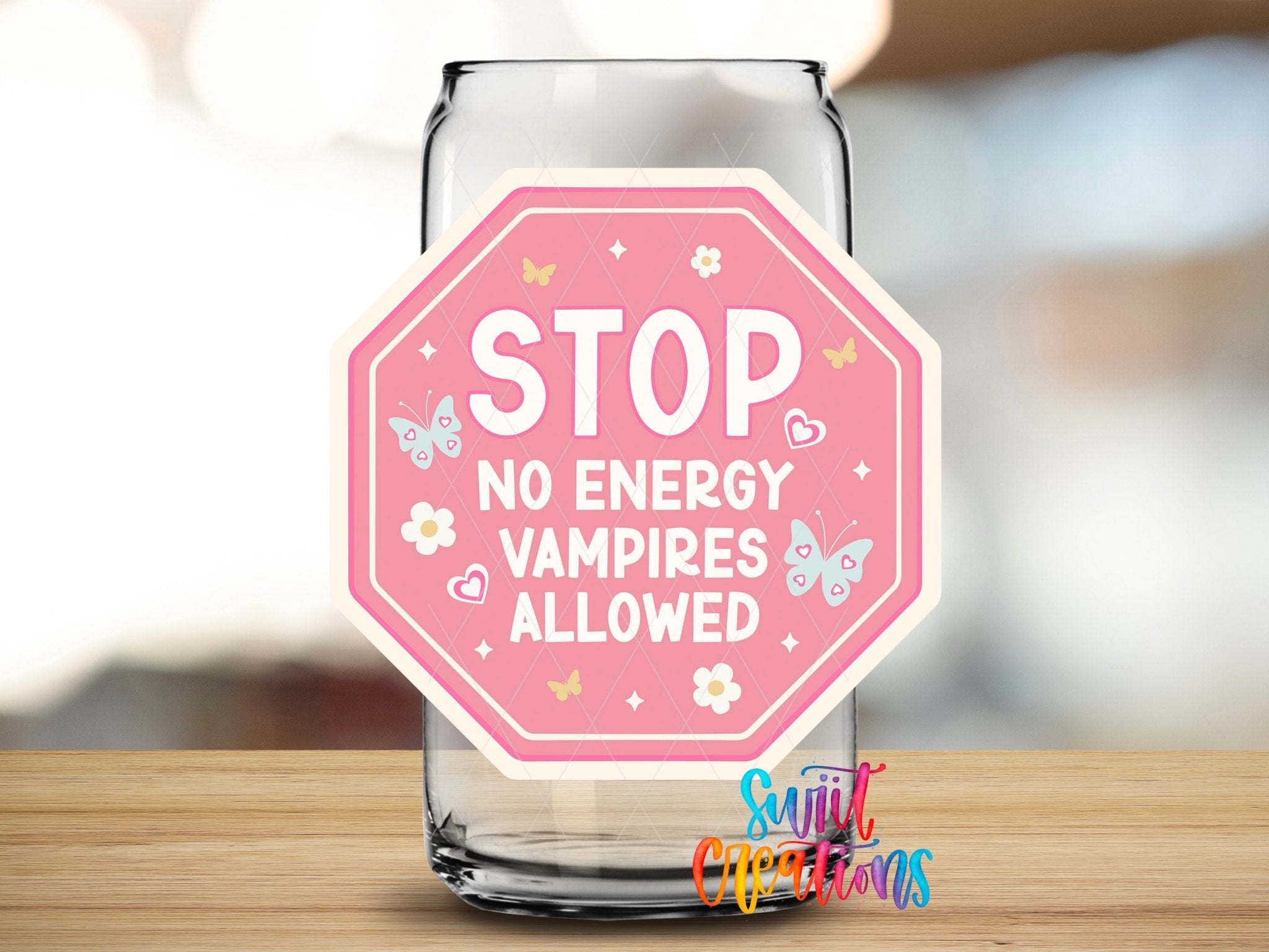 Stop No Energy Vampires UV DTF transfer applied to a clear glass can from Swiit Creations
