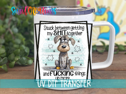 Stuck Between Getting My Sh*t Together UV DTF transfer on a white stainless steel mug with a lid