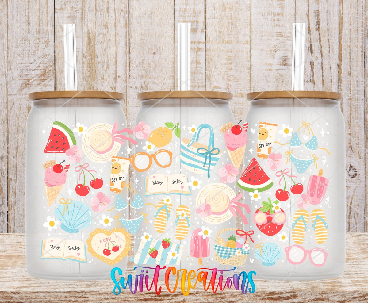 Summer Beach UV DTF wrap on three clear glass cans with bamboo lids