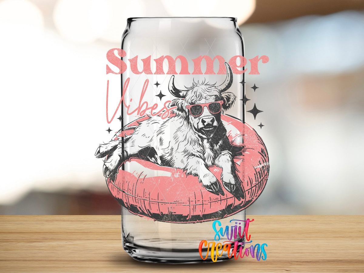 Close-up of the Summer Vibes highland cow and stars UV DTF transfer on a clear glass can
