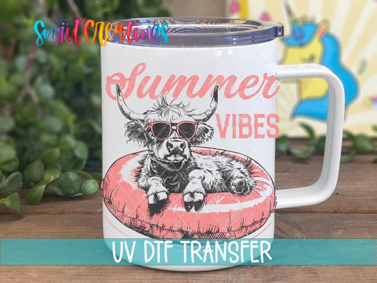 Summer Vibes highland cow on a pink float UV DTF transfer on a white stainless steel mug with a lid