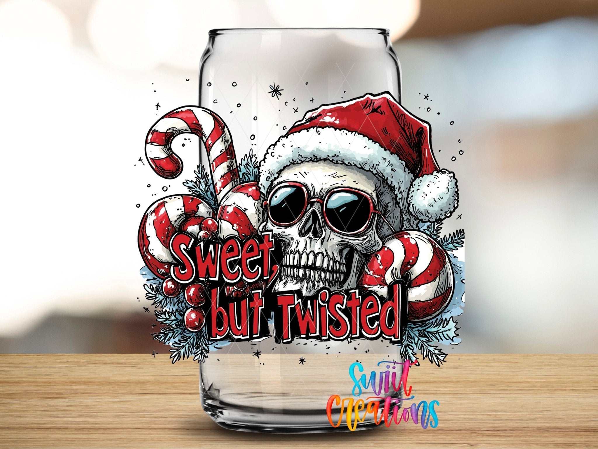 Swiit Creations UV DTF Sweet But Twisted Christmas Skull transfer applied to a clear glass can