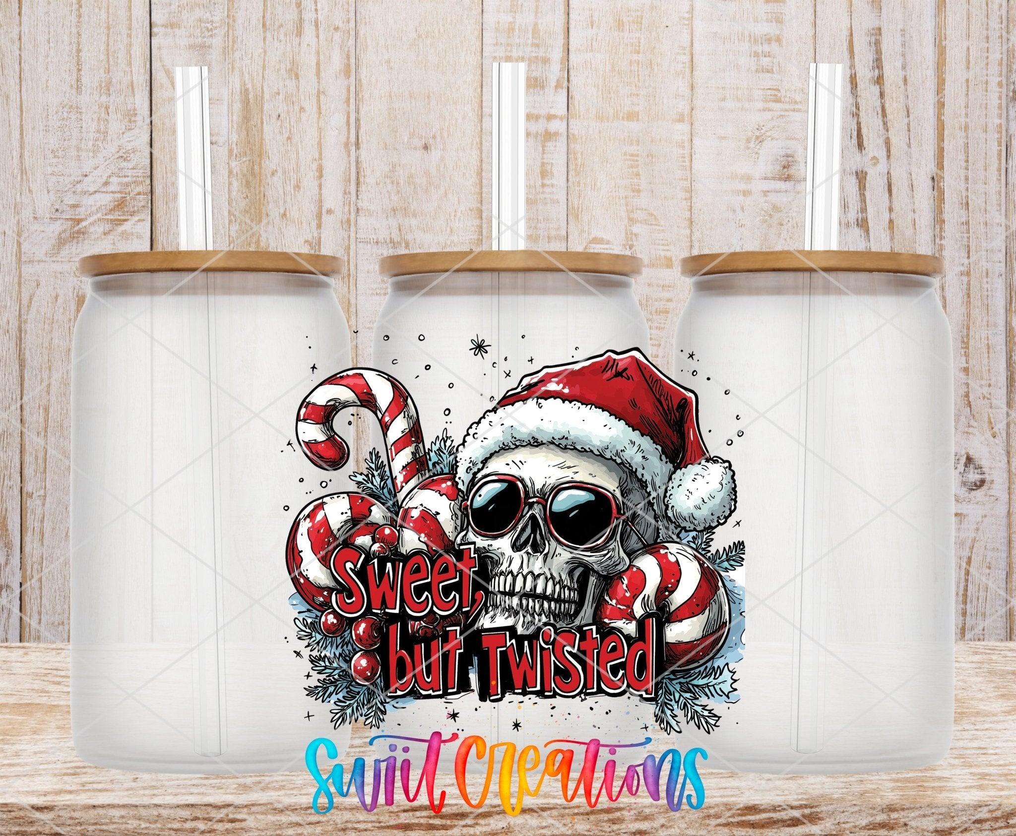Swiit Creations UV DTF Sweet But Twisted Christmas Skull transfer shown on a clear glass can set