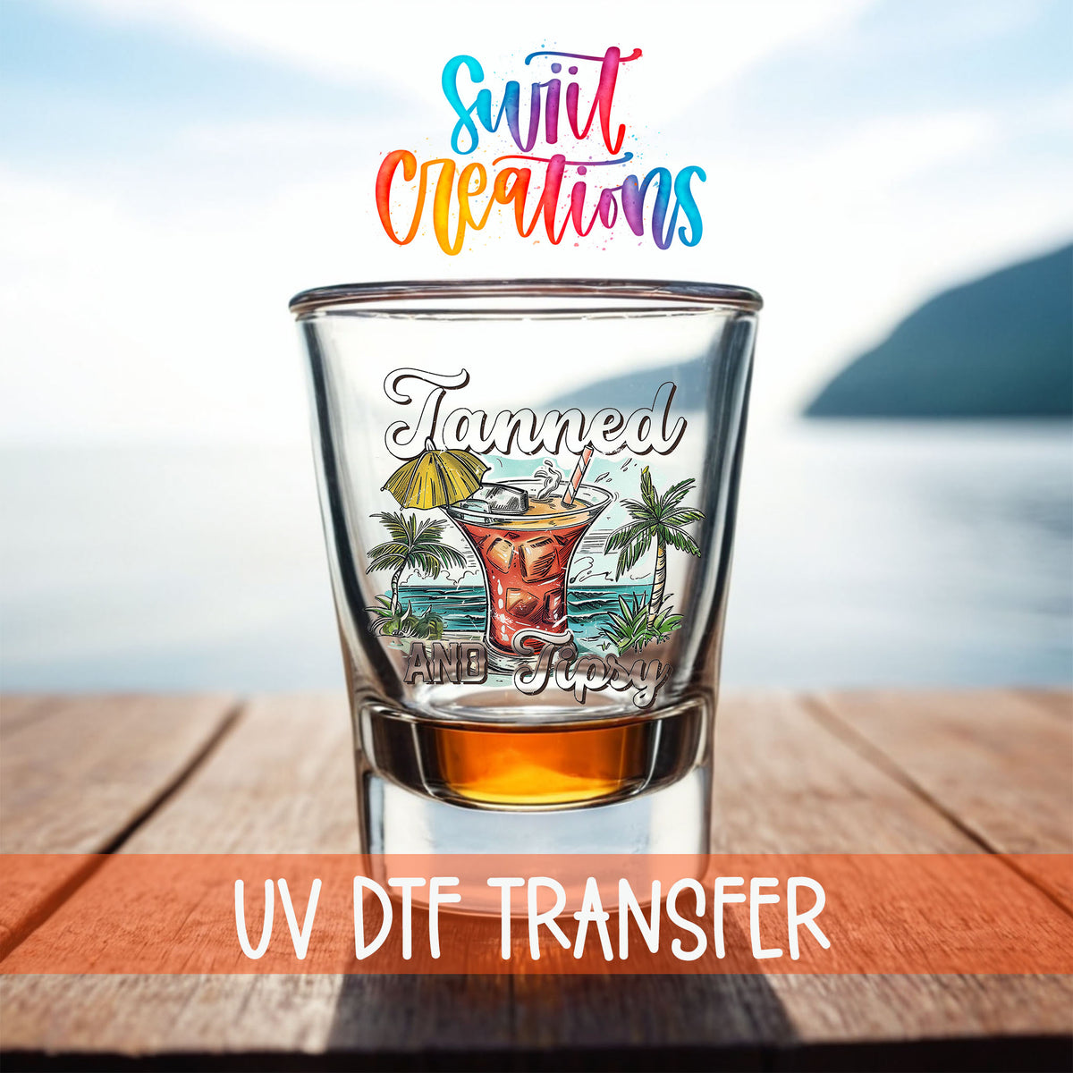 Tanned and Tipsy shot glass UV DTF transfer on a filled shot glass on a dock by the water