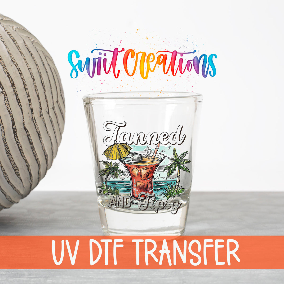 Tanned and Tipsy UV DTF transfer on a clear shot glass with the Swiit Creations logo and UV DTF Transfer banner