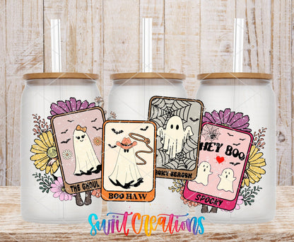 Tarot Card Ghosts UV DTF wrap on three clear glass cans with bamboo lids