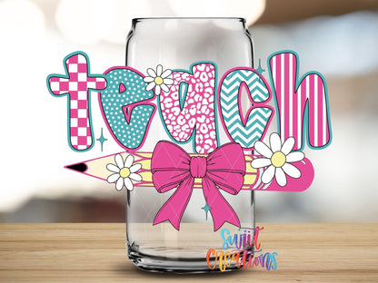 Close-up of the Teach pink bow and pencil UV DTF transfer on a clear glass can