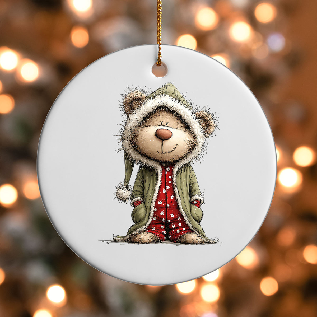 Teddy Bear in Hooded Pajamas ornament UV DTF transfer on a round white ornament with a bokeh light background