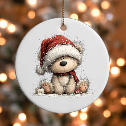 Teddy Bear in Santa Hat ornament UV DTF transfer on a round white ornament with a bokeh light background