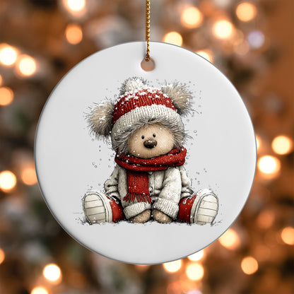 Teddy Bear in Winter Hat ornament UV DTF transfer on a round white ornament with a bokeh light background