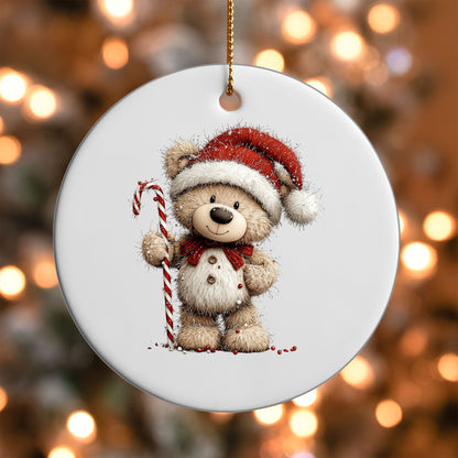 Teddy Bear with Candy Cane ornament UV DTF transfer on a round white ornament with a bokeh light background