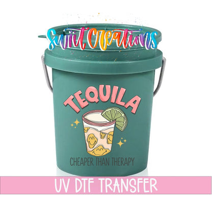 Tequila Cheaper Than Therapy UV DTF transfer on a teal mini bucket with a lid on a white background