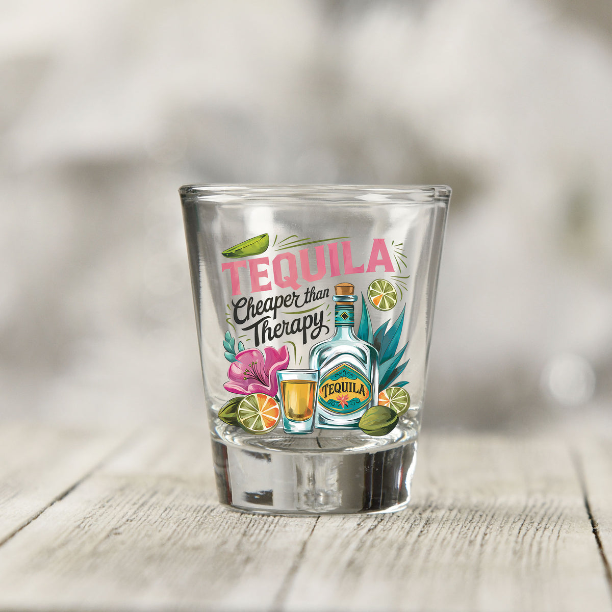 Close-up of the Tequila Cheaper Than Therapy UV DTF transfer on a clear shot glass