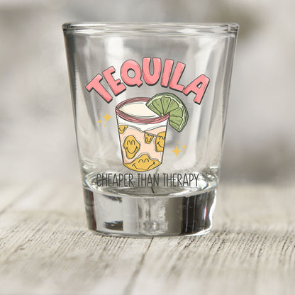 Tequila Cheaper Than Therapy shot glass UV DTF transfer with shot glass with lime and smiley faces on a clear shot glass