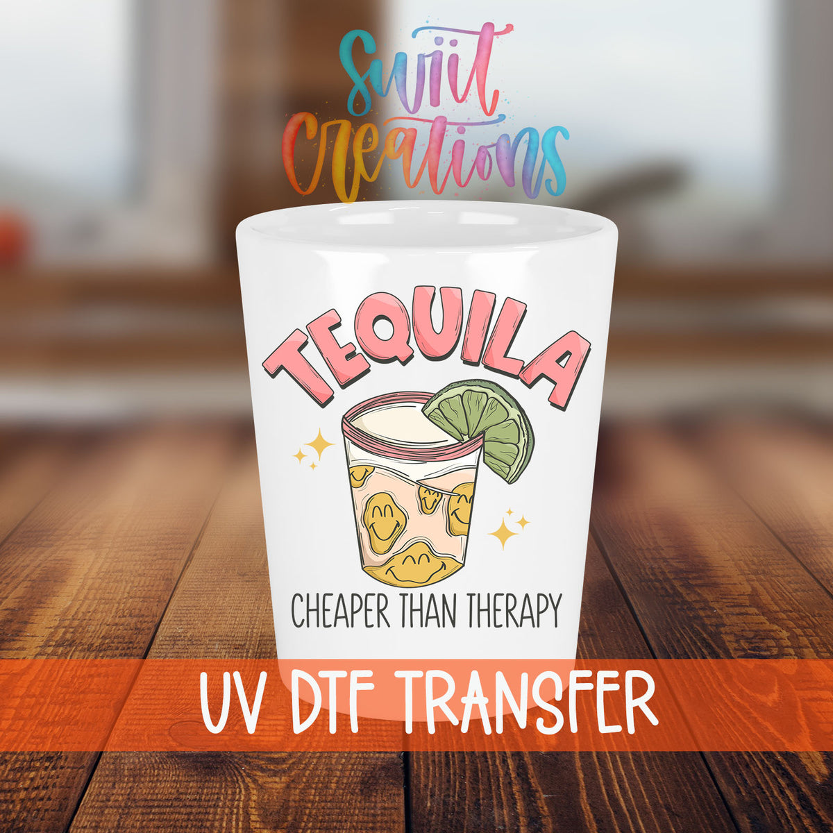 Tequila Cheaper Than Therapy shot glass transfer on a white shot glass on a wooden table