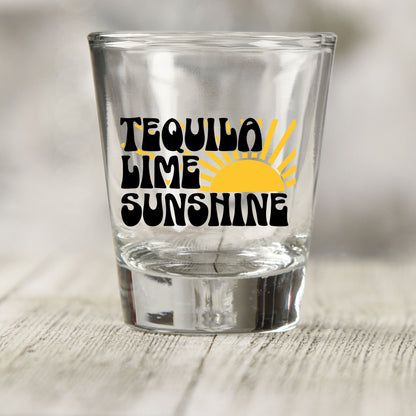 Tequila Lime Sunshine shot glass UV DTF transfer with yellow sun graphic on a clear shot glass