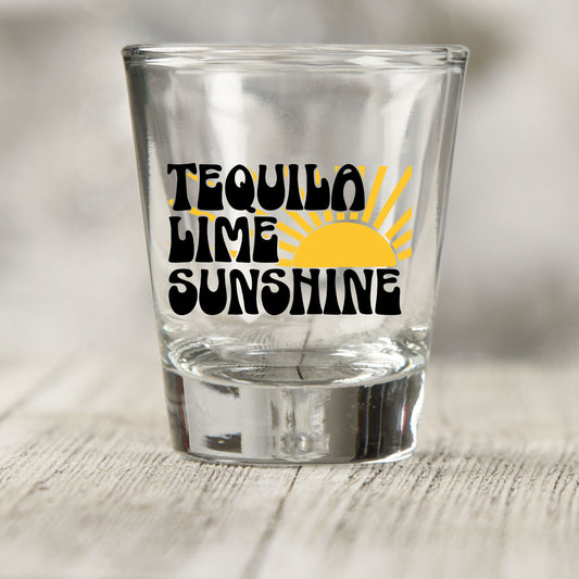Tequila Lime Sunshine shot glass UV DTF transfer with yellow sun graphic on a clear shot glass