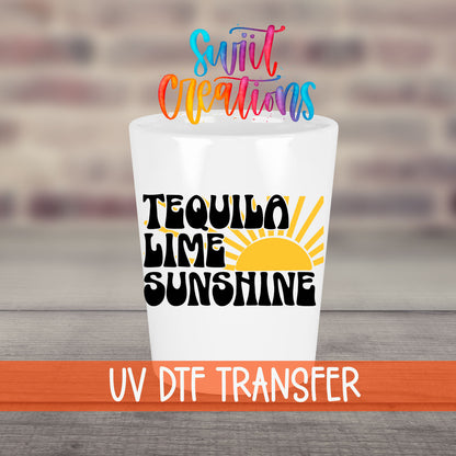 Tequila Lime Sunshine UV DTF transfer on a white shot glass in front of a brick wall