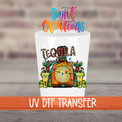 Tequila Squad UV DTF transfer on a white shot glass in front of a brick wall