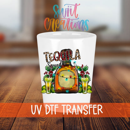 Tequila Squad shot glass transfer on a white shot glass on a wooden table