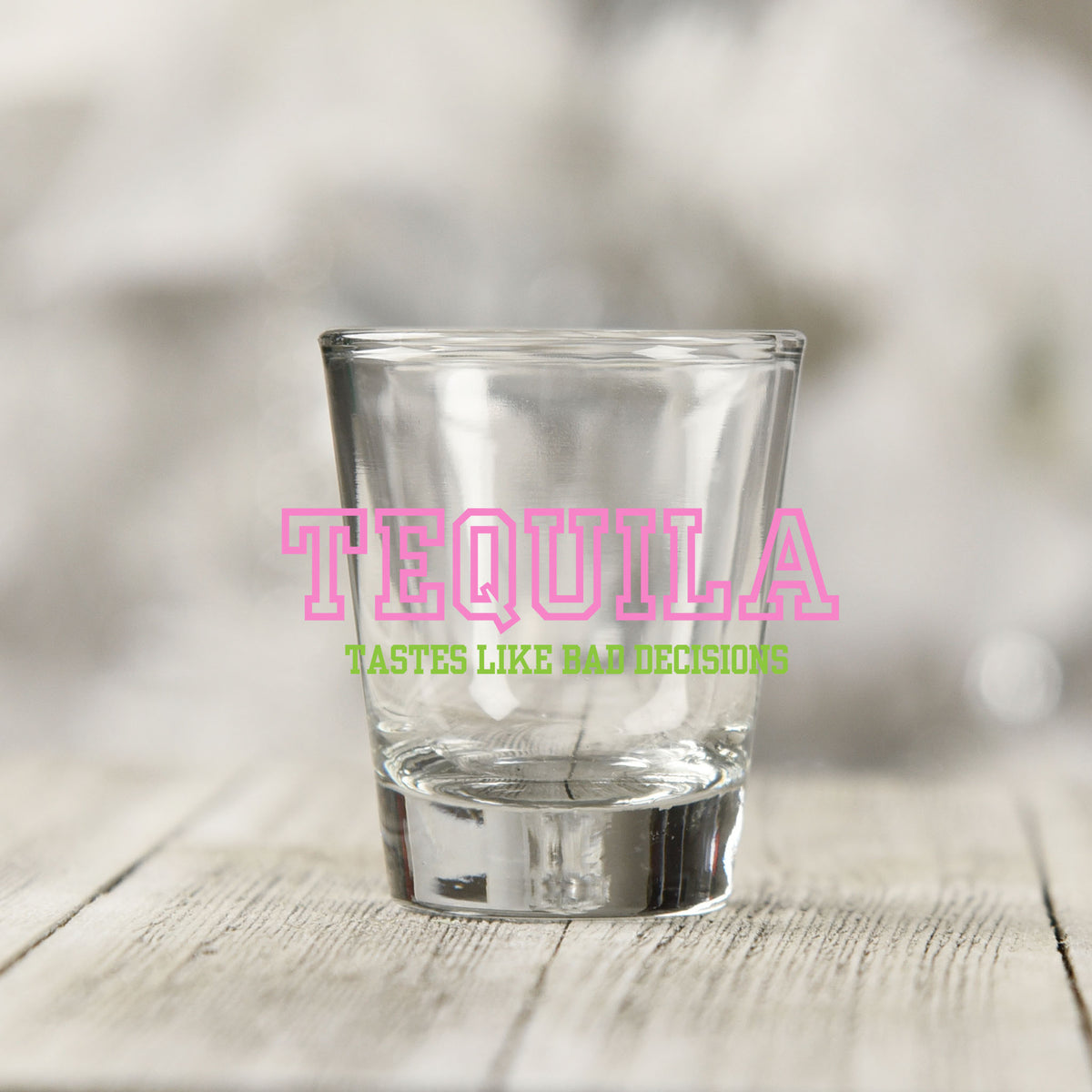 Close-up of the Tequila Tastes Like Bad Decisions UV DTF transfer on a clear shot glass