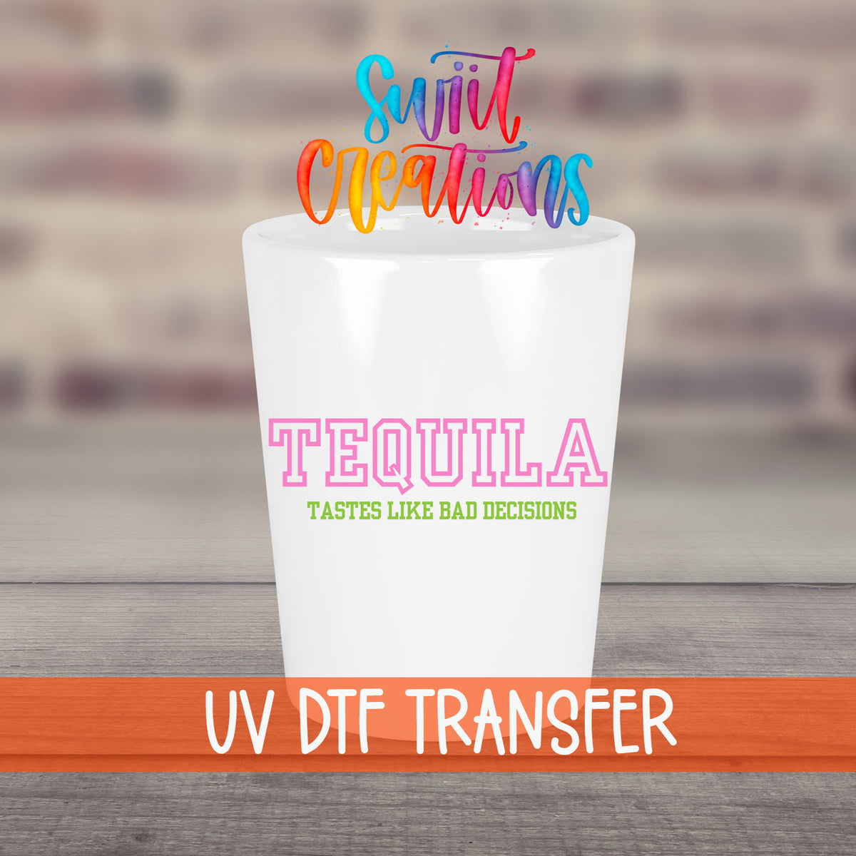 Tequila Tastes Like Bad Decisions UV DTF transfer on a white shot glass in front of a brick wall
