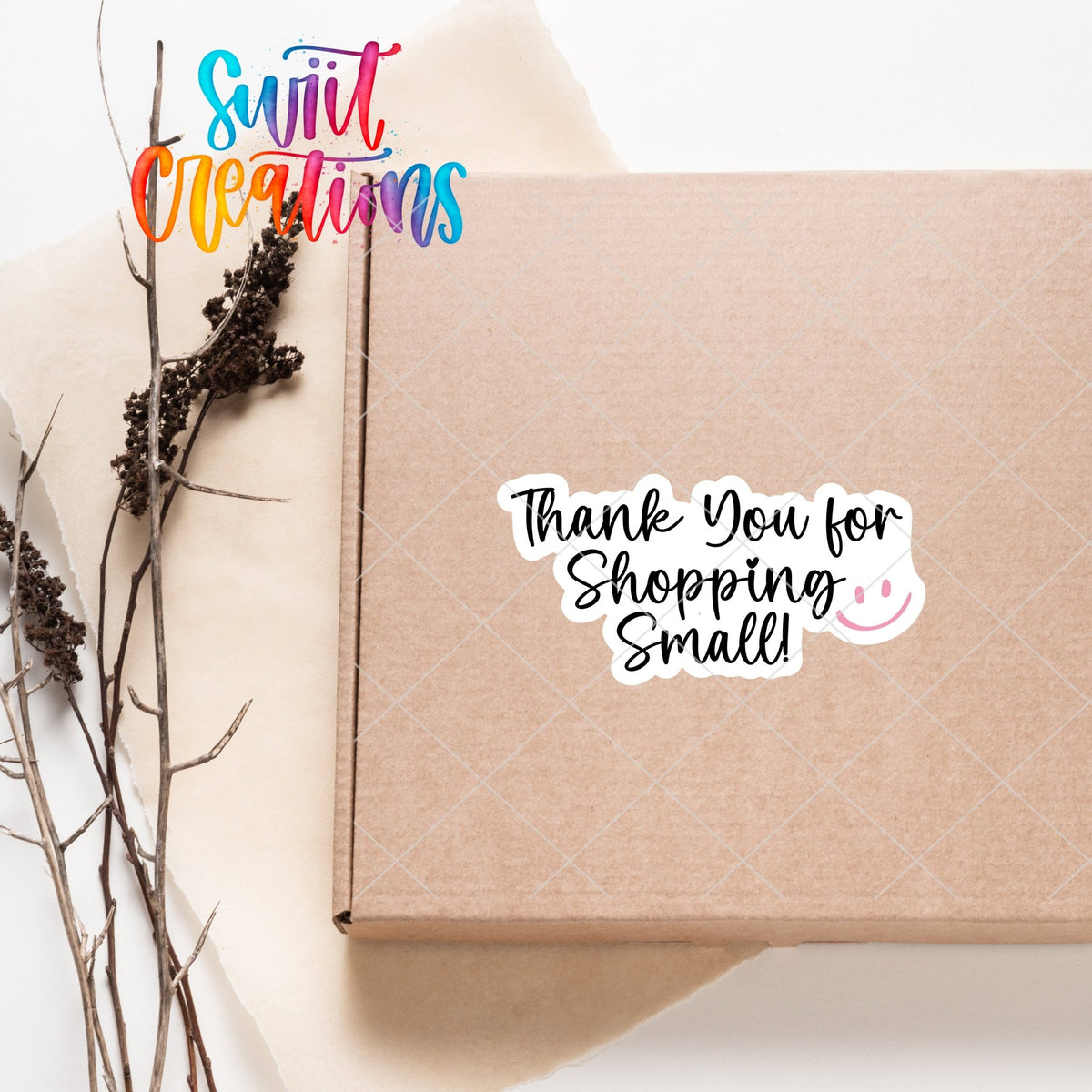 Thank You for Shopping Small Smiley sticker on a kraft shipping box