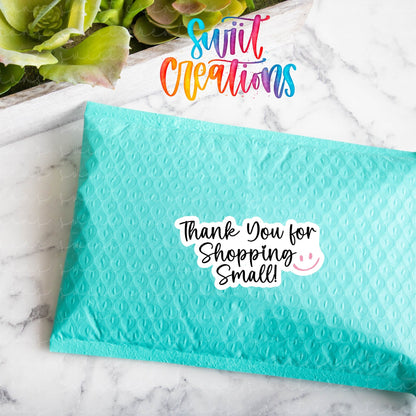 Thank You for Shopping Small Smiley sticker on a teal poly mailer
