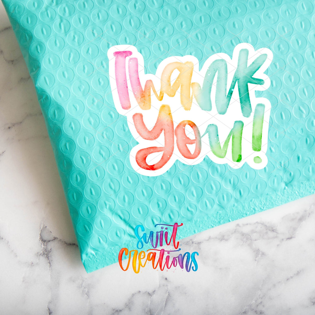 Watercolor Rainbow Thank You sticker sealing a teal poly mailer