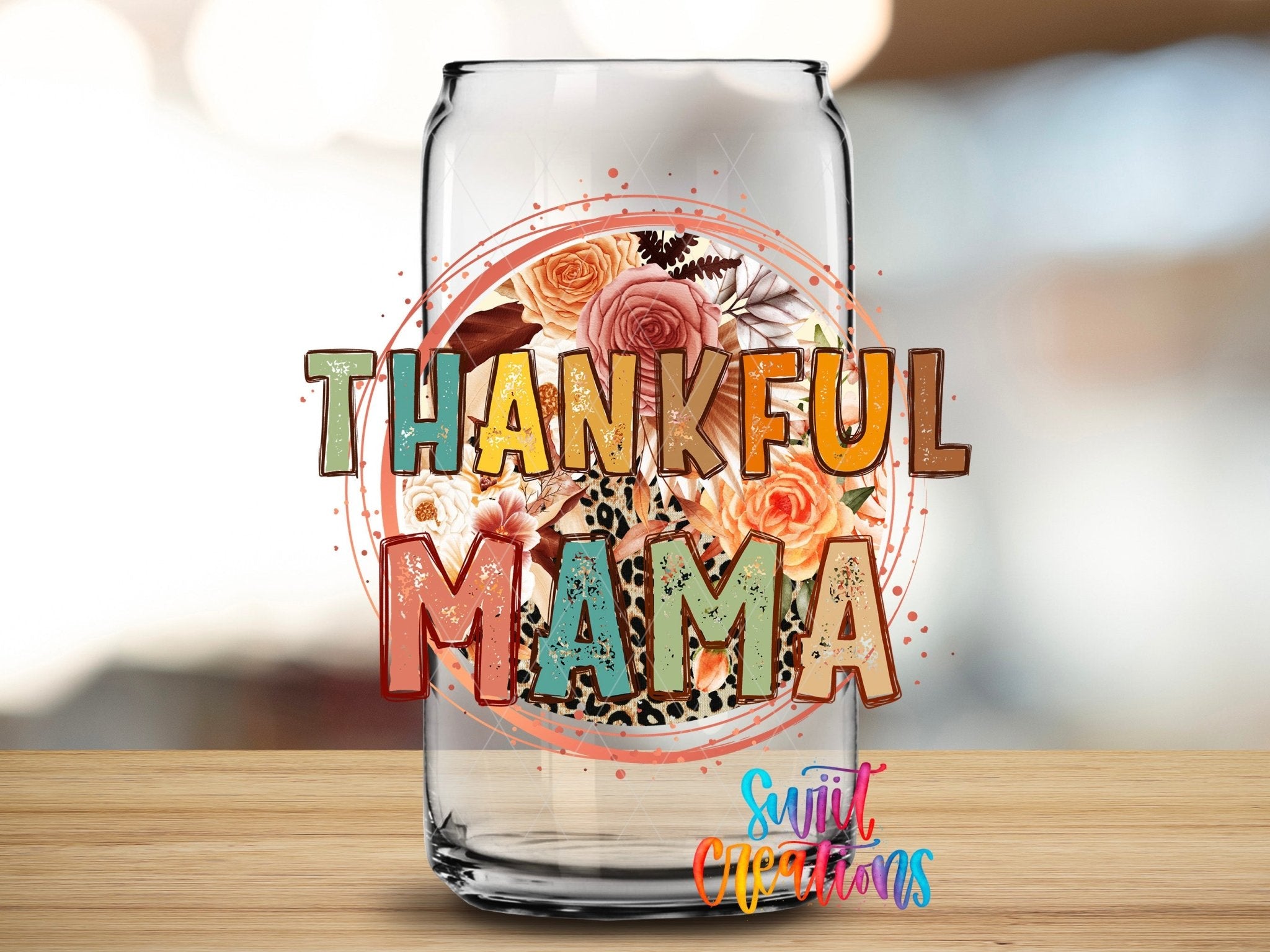 Thankful Mama Fall Floral Leopard UV DTF transfer applied to a clear glass can from Swiit Creations