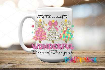It's the Most Wonderful Time of the Year leopard trees and bow UV DTF transfer on a white ceramic coffee mug