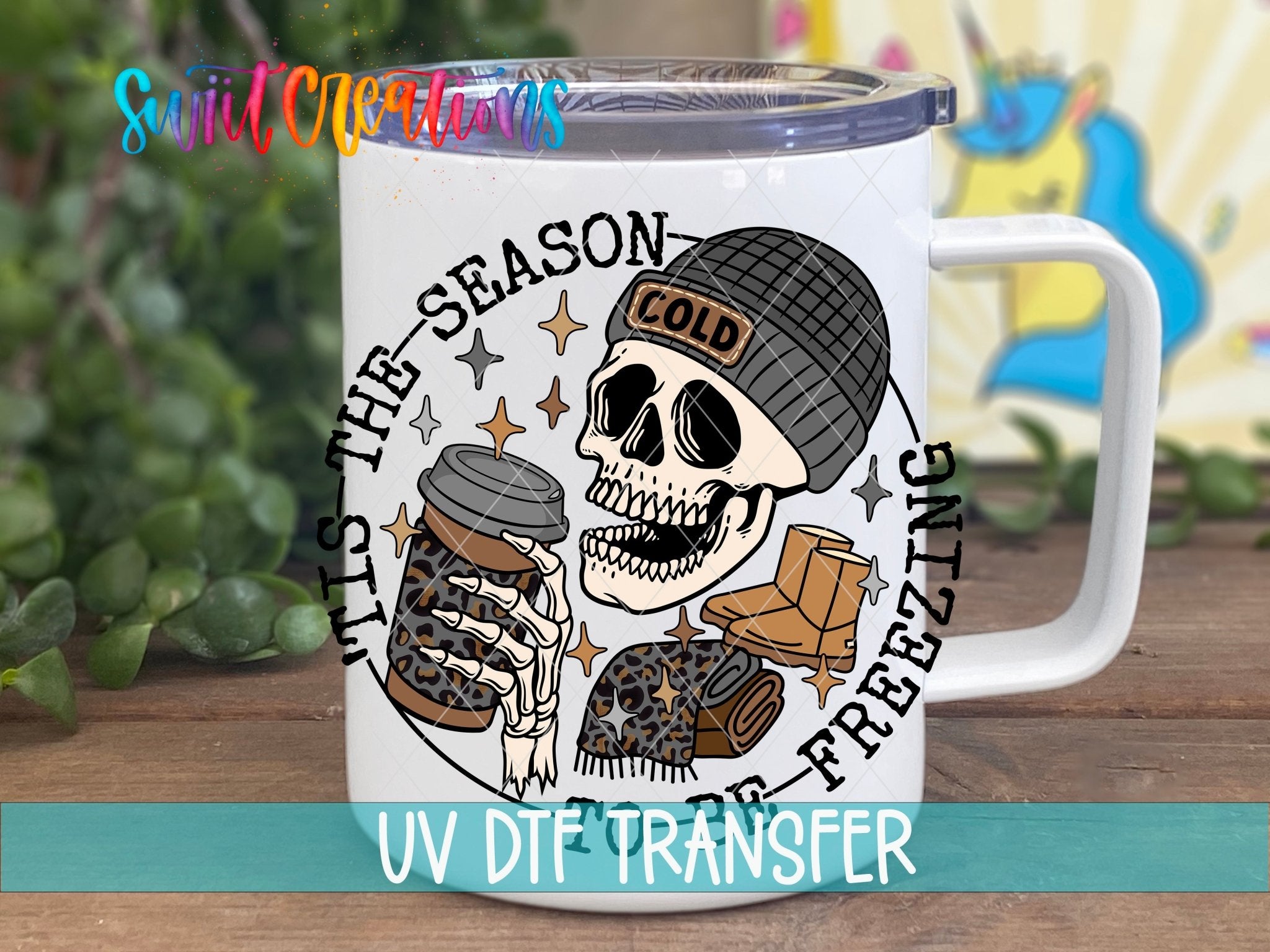 Swiit Creations UV DTF Tis The Season To Be Freezing transfer displayed on a white coffee mug