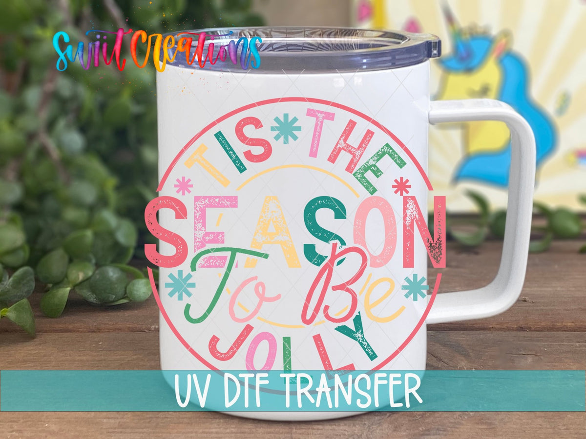 Tis the Season to Be Jolly UV DTF transfer on a white stainless steel mug with a lid