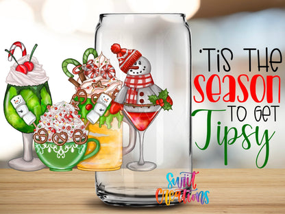 Close-up of the Tis the Season to Get Tipsy UV DTF wrap on a clear glass can