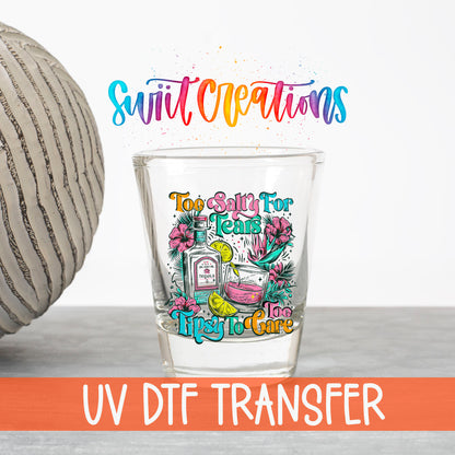 Too Salty For Tears Too Tipsy To Care UV DTF transfer on a clear shot glass with the Swiit Creations logo and UV DTF Transfer banner