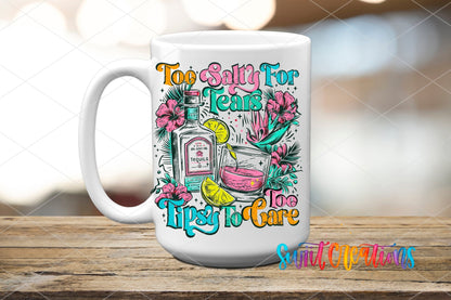 Too Salty for Tears Too Tipsy to Care UV DTF transfer on a white ceramic coffee mug