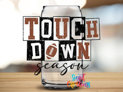 Close-up of the Touchdown Season UV DTF transfer on a clear glass can