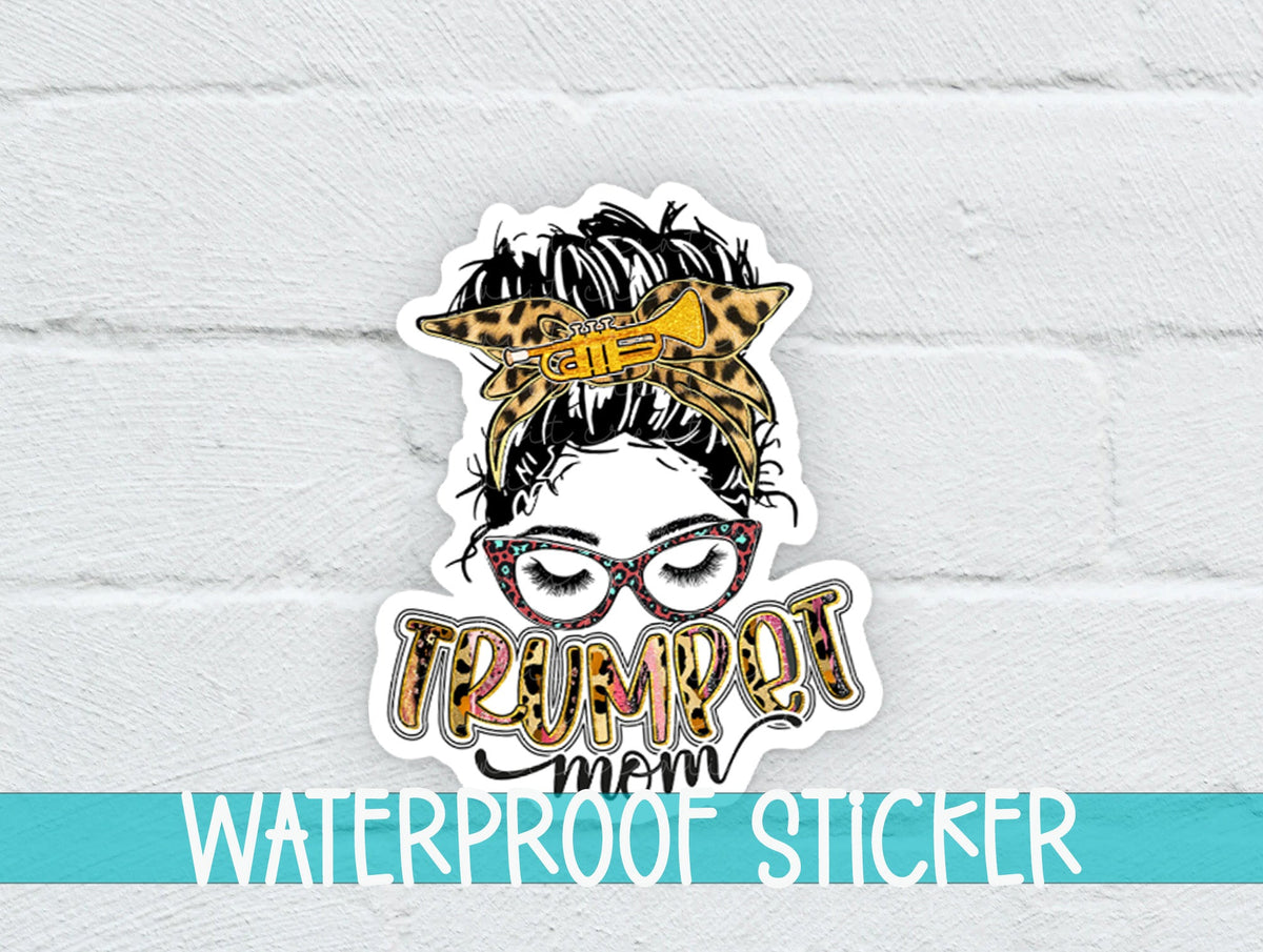 Trumpet Mom sticker on a white brick background with a waterproof sticker banner