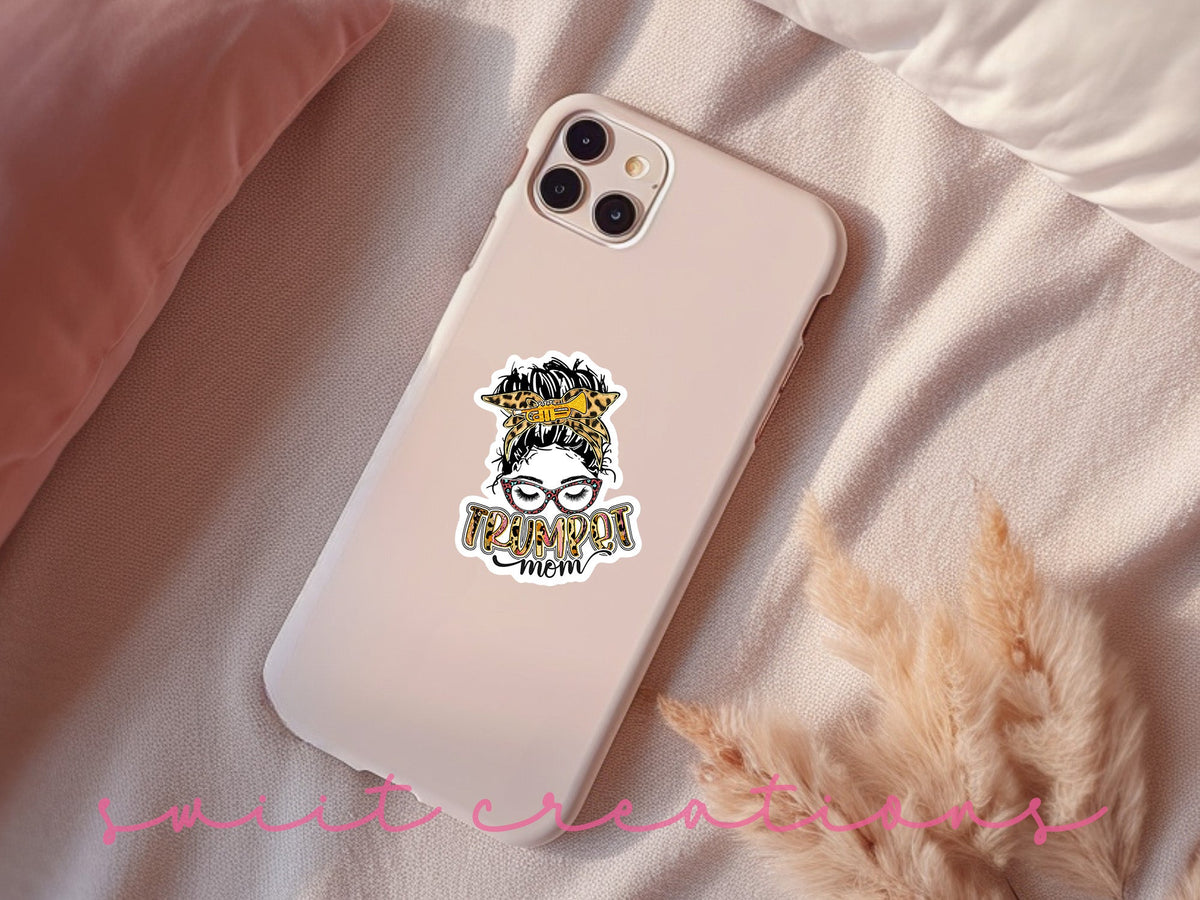 Trumpet Mom sticker on a pink phone case