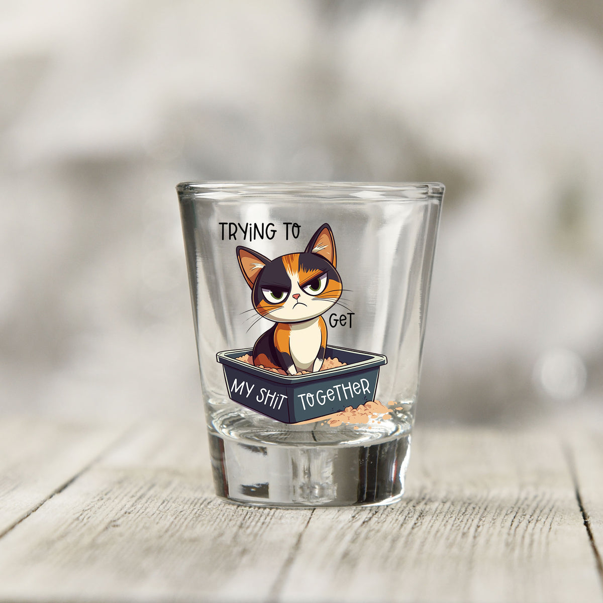 Close-up of the Trying to Get My Sh*t Together UV DTF transfer on a clear shot glass