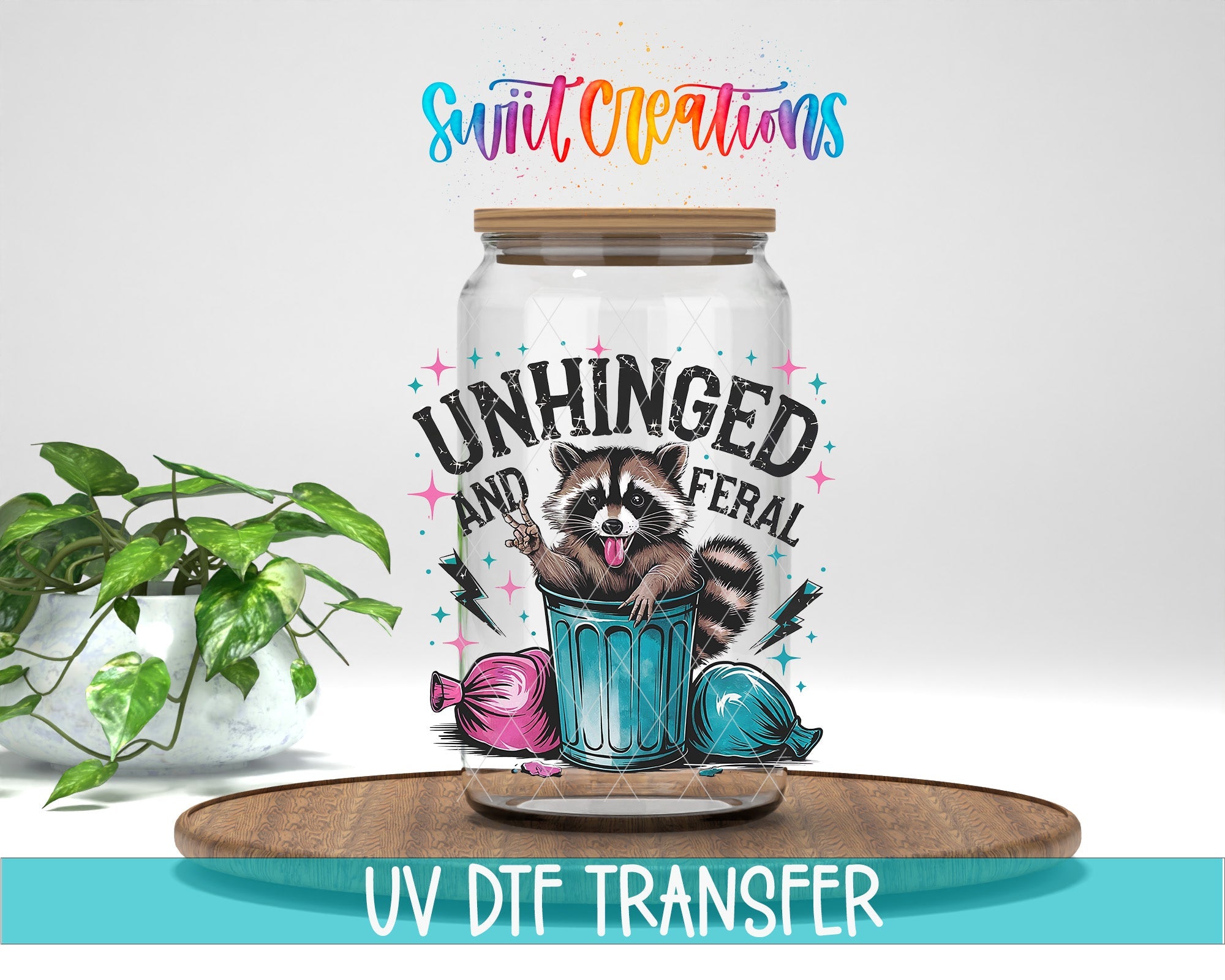 Unhinged and Feral Sassy Raccoon UV DTF transfer displayed on a clear jar mockup from Swiit Creations