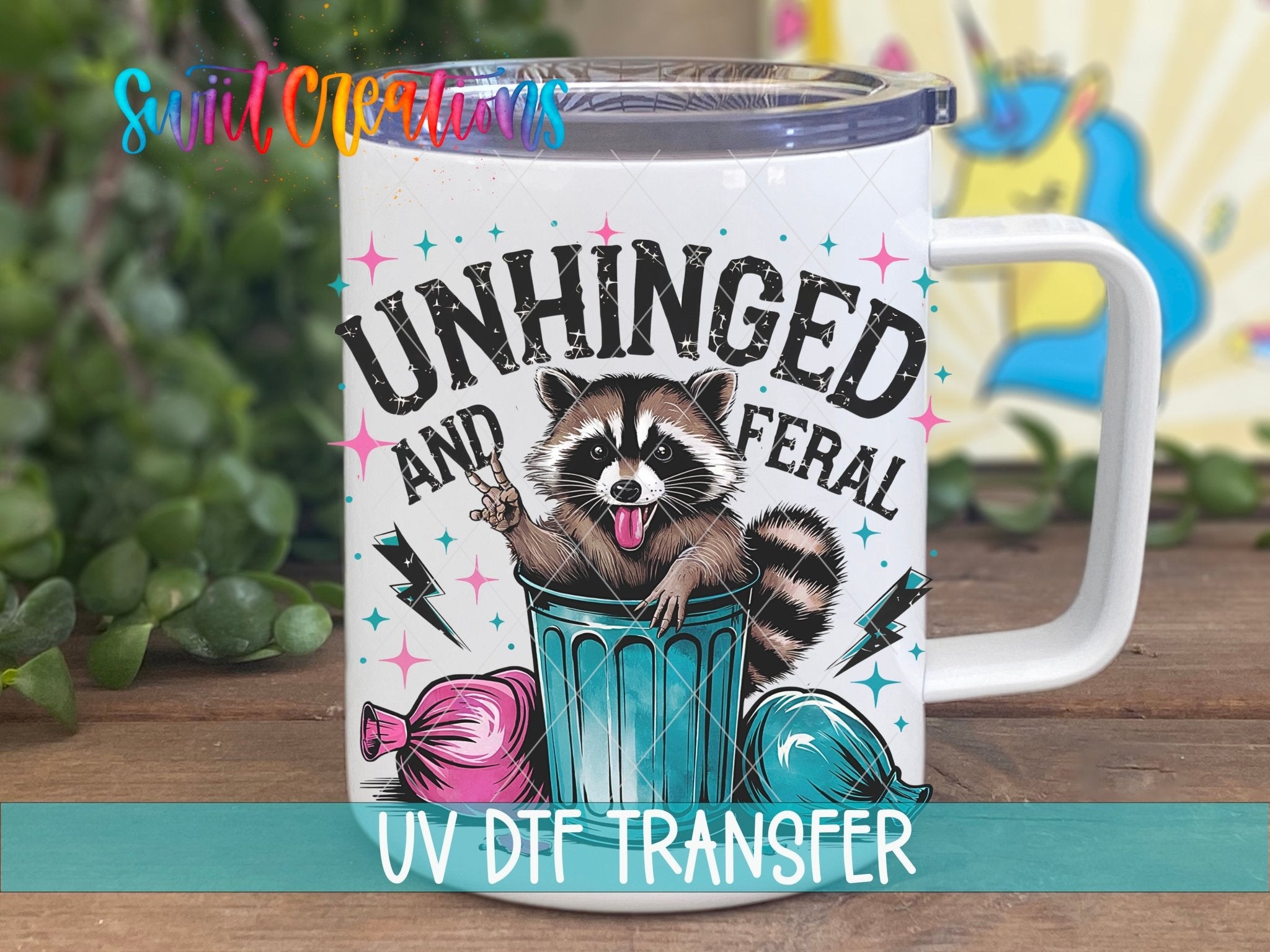 Unhinged and Feral Sassy Raccoon UV DTF transfer displayed on a white coffee mug from Swiit Creations