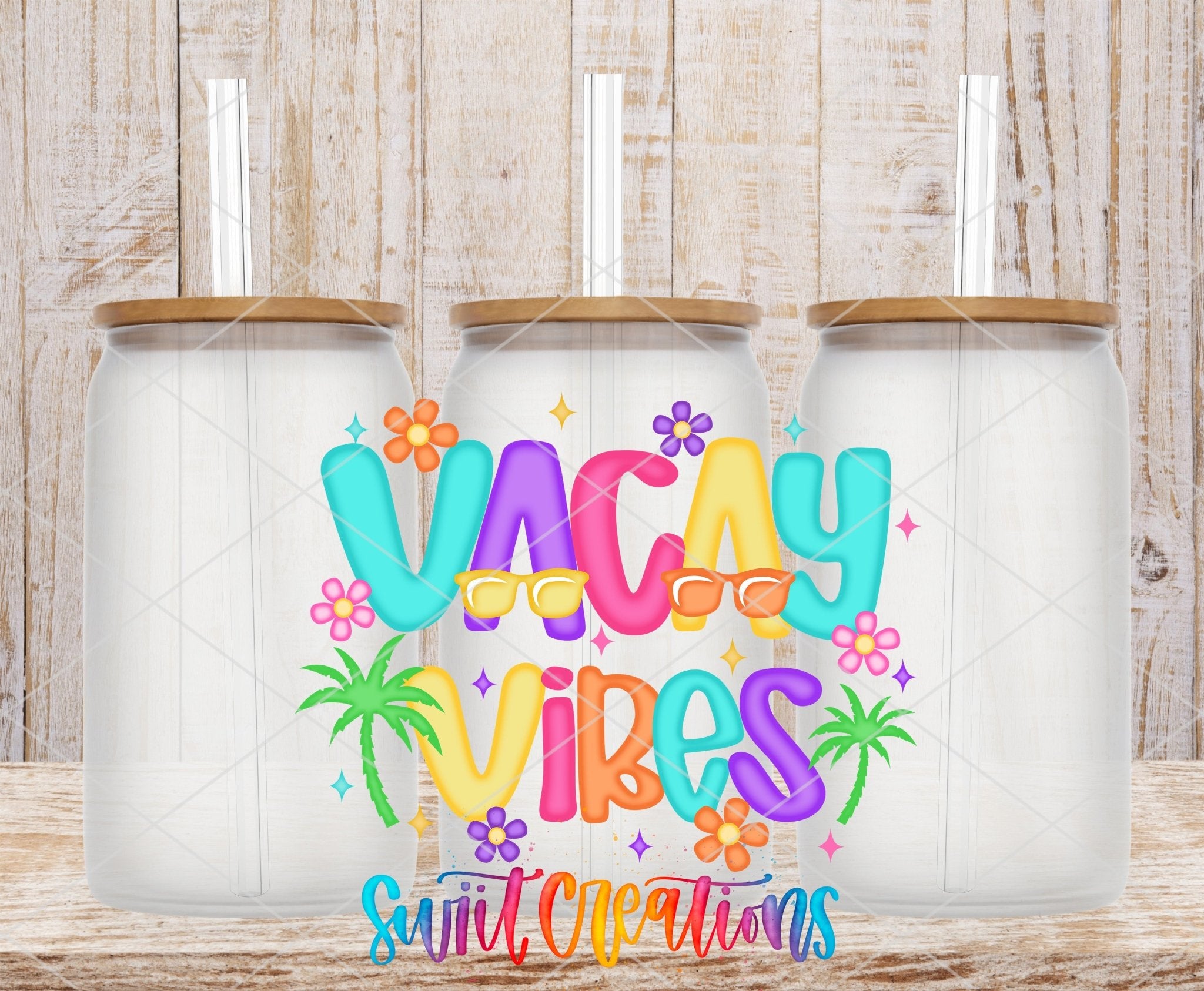 Vacay Vibes Tropical Summer UV DTF transfer applied to a clear glass can set from Swiit Creations